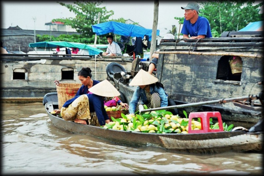 We took the 'bus' south to Can Tho, to see the floating market.  We're sure it used to be a bus in the 1960's.  
